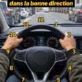 Une femme concentrée au volant de sa voiture en direction sur une route