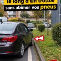 Femme en train de se garer soigneusement en bord de trottoir, voiture à proximité.